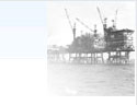 British Gas story image: Faded black and white photograph of a natural gas rig